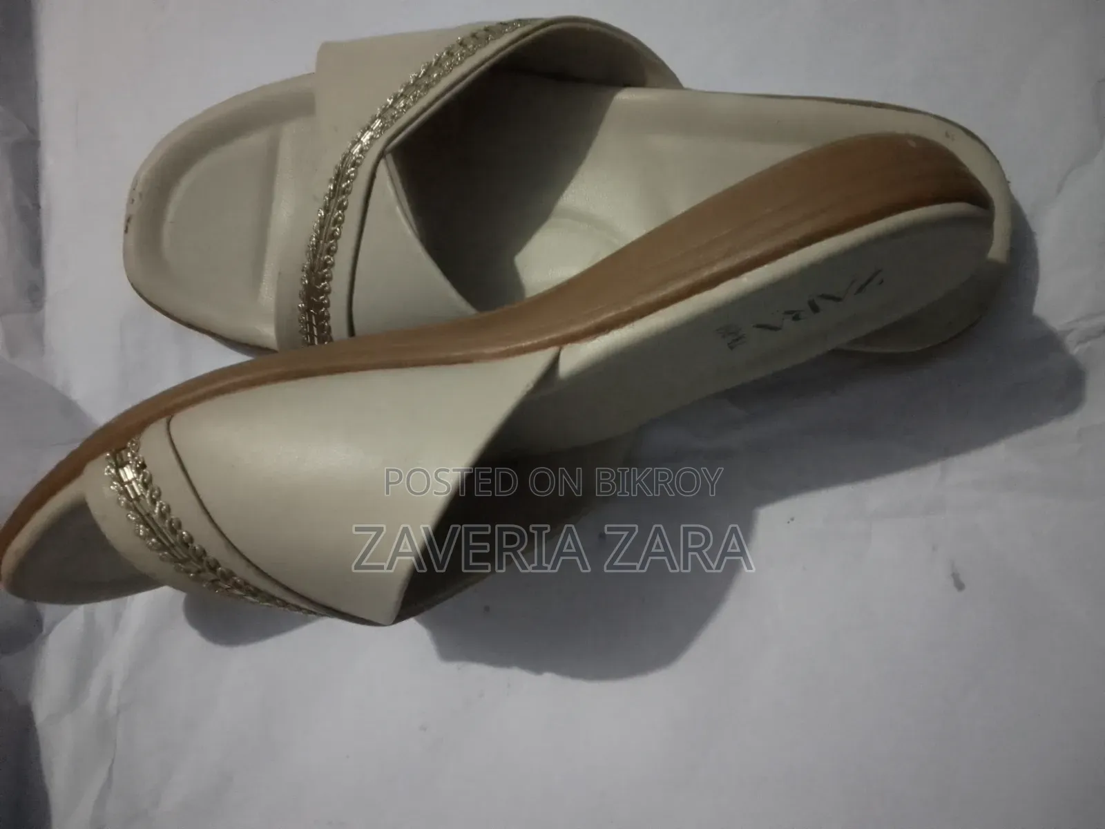 Size: 39. Selling because I am not used to wearing slippers.