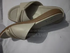 Size: 39. Selling because I am not used to wearing slippers.