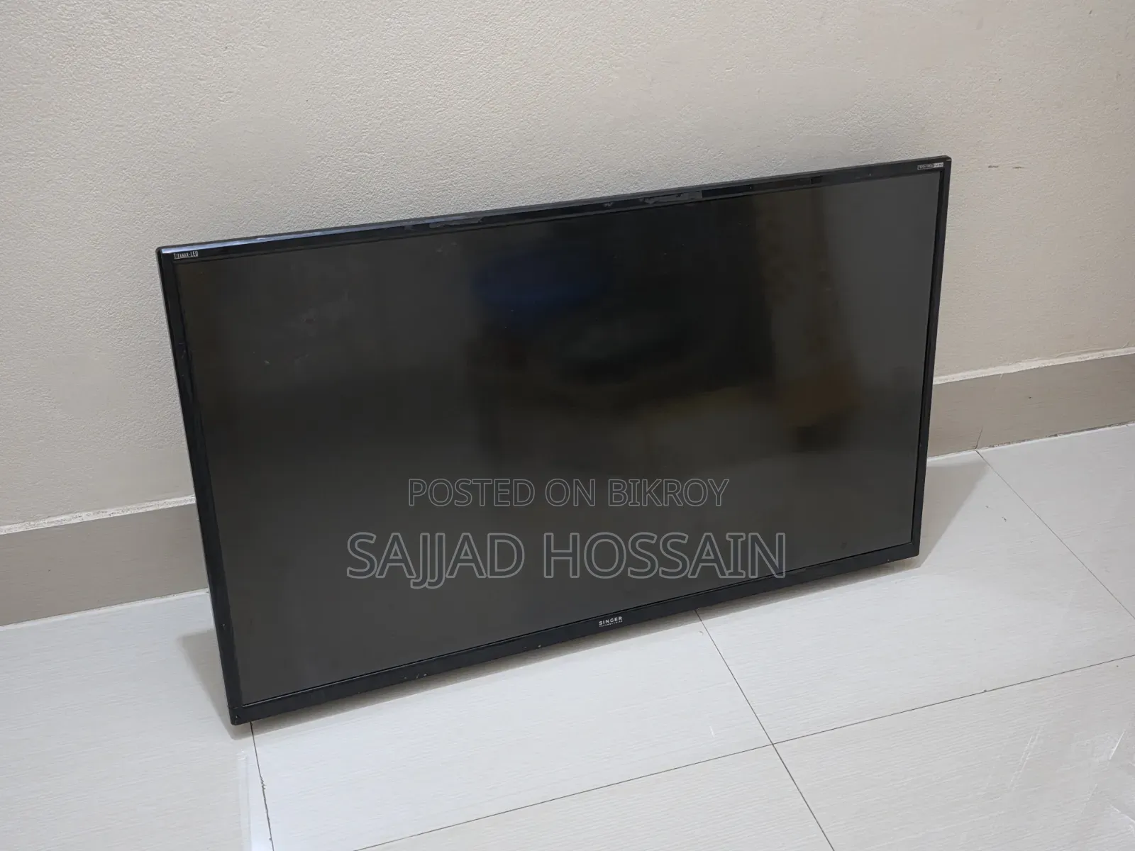 SINGER Flat-Screen Television