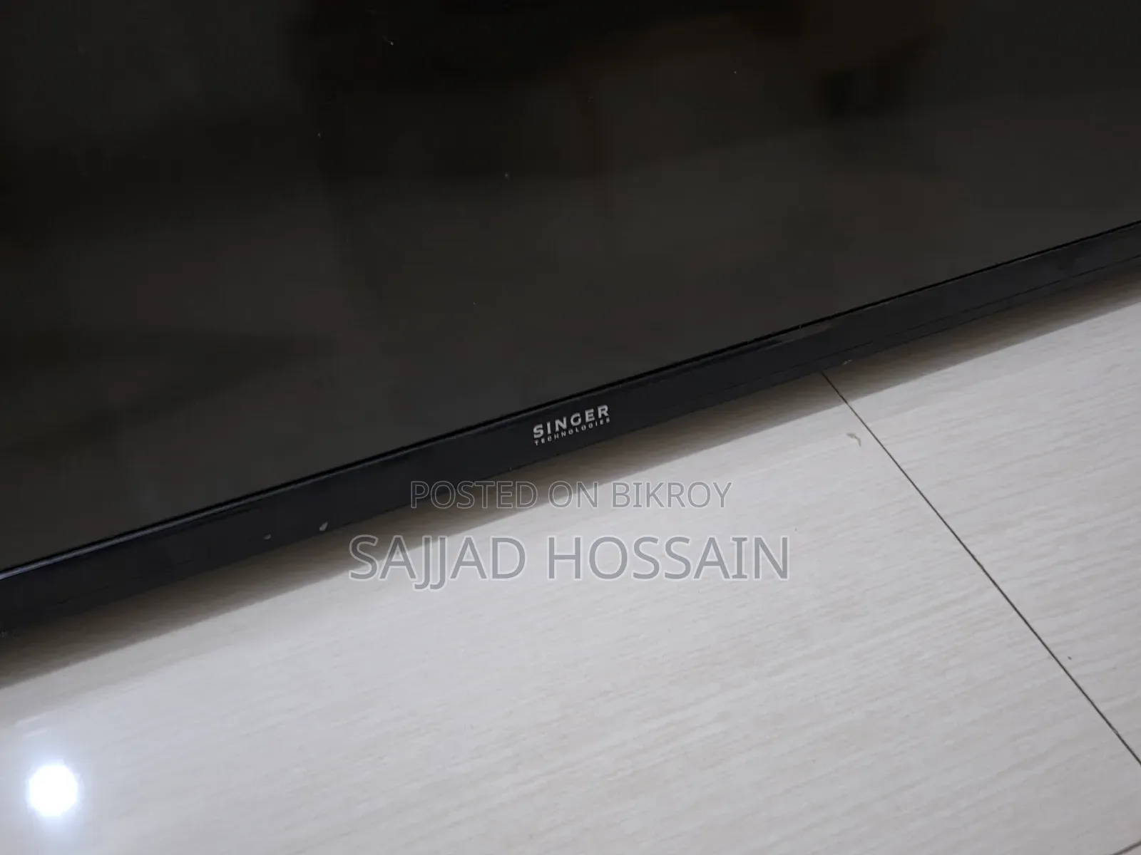 SINGER Flat-Screen Television