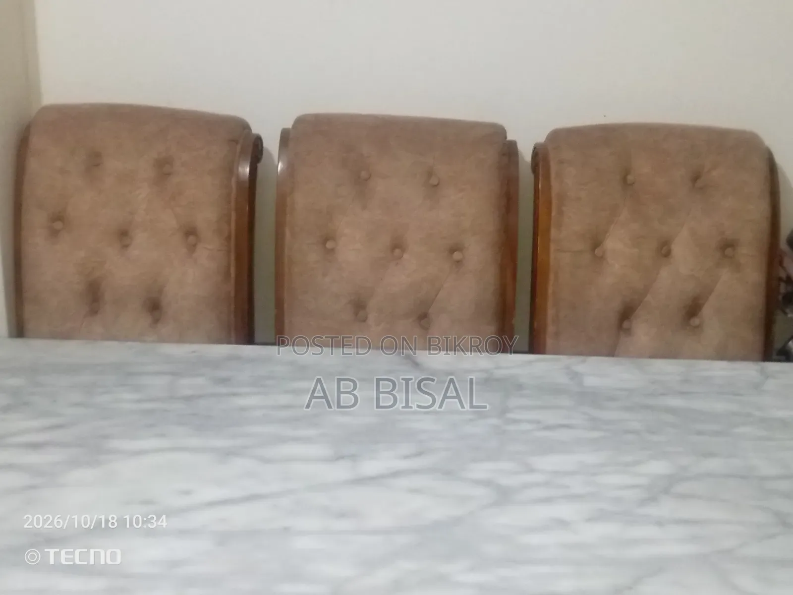 A marble dining table with 6 chairs for sale