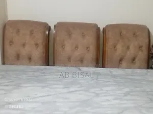 A marble dining table with 6 chairs for sale