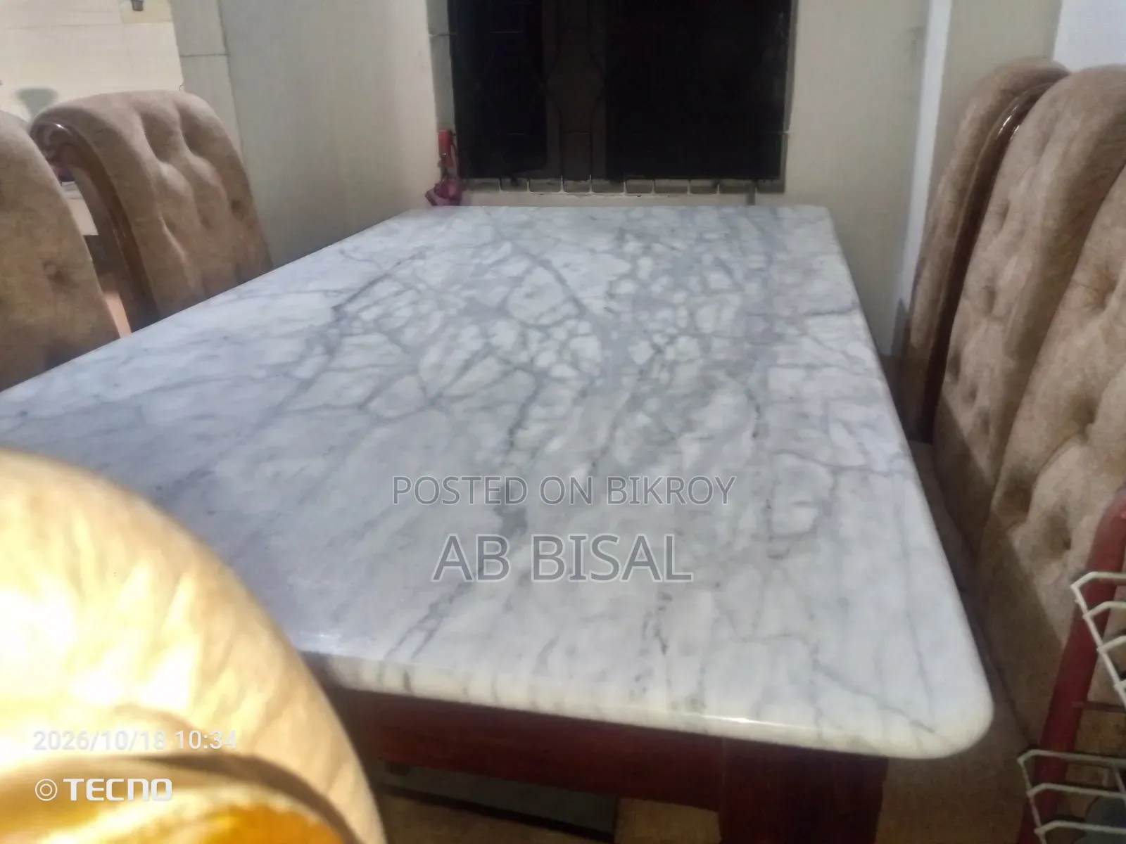 A marble dining table with 6 chairs for sale