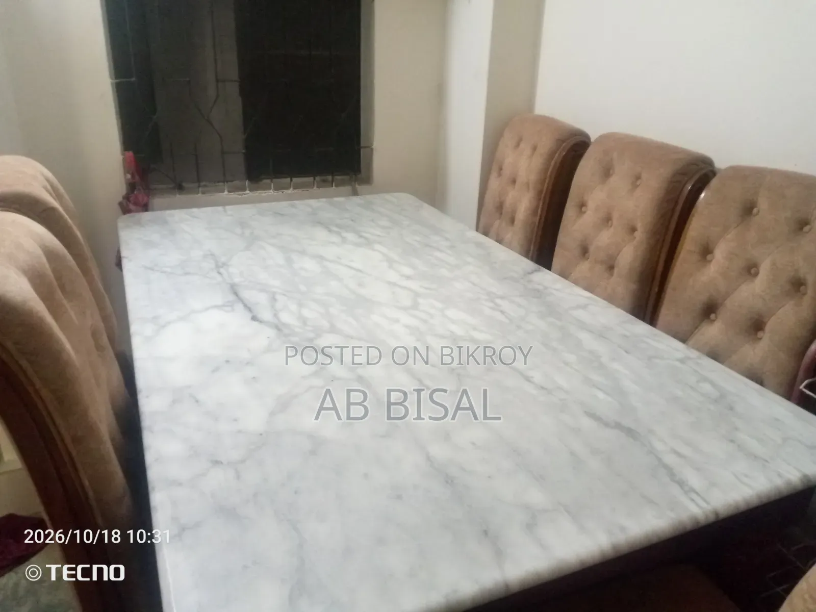 A marble dining table with 6 chairs for sale