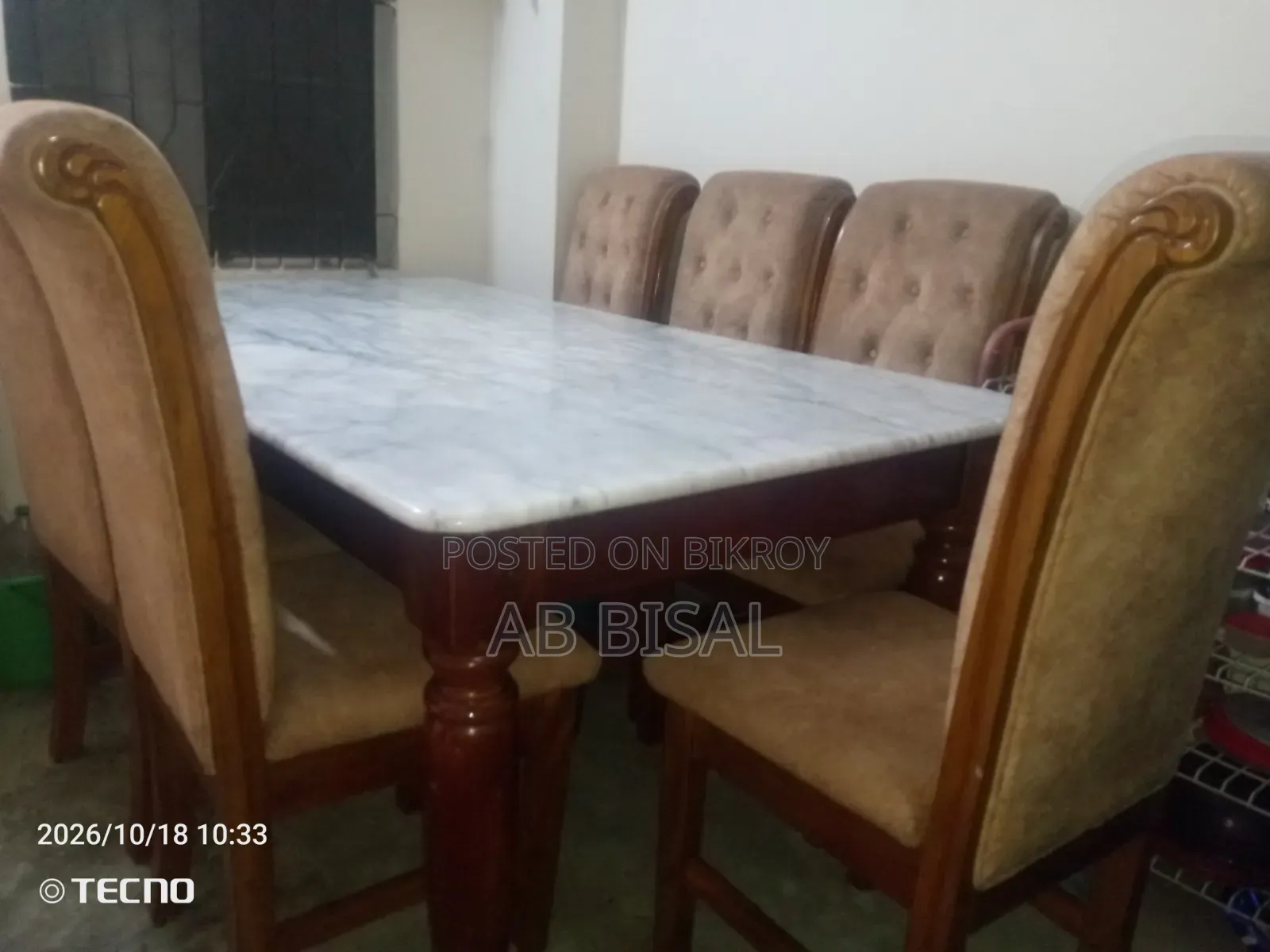 A marble dining table with 6 chairs for sale