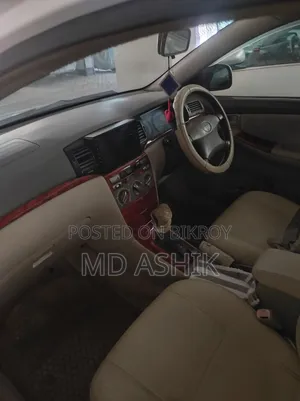 টয়োটা করোল্লা সেডান ২০০৫ সাদা