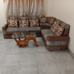 ডিজাইনার কাঁচের সেন্টার টেবিলসহ কর্নার এল শেপ সোফা সেট