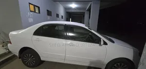 টয়োটা করোল্লা সেডান ২০০৪ সাদা