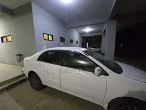 টয়োটা করোল্লা সেডান ২০০৪ সাদা