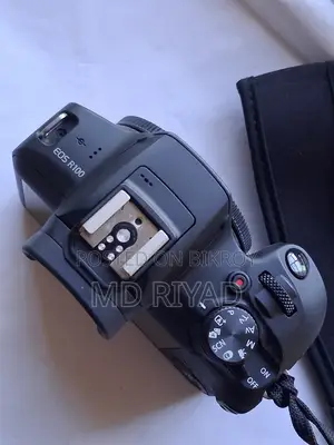 ক্যানন আর১০০ লেন্সসহ