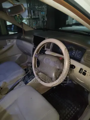 টয়োটা করোল্লা ব্রেক ২০০৩ সাদা
