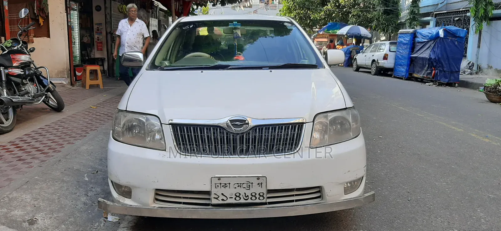 টয়োটা করোলা ২০০৪ সাদা