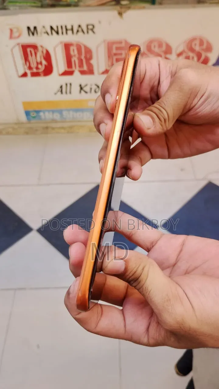 ইনফিনিক্স নোট এজ ১২৮ জিবি কমলা