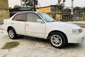 টয়োটা করোল্লা সেডান ২০০৩ সাদা