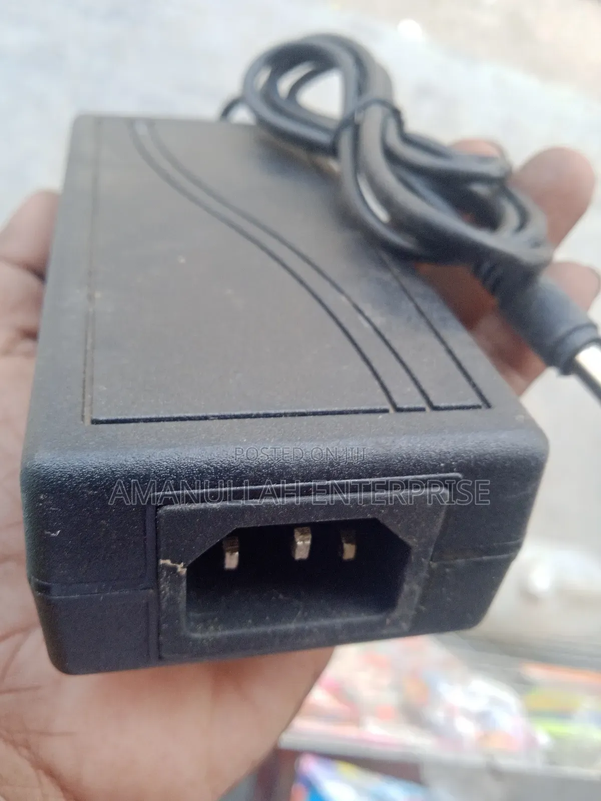 Ac - Dc Power Adapter Powering Various Electronic Devices.