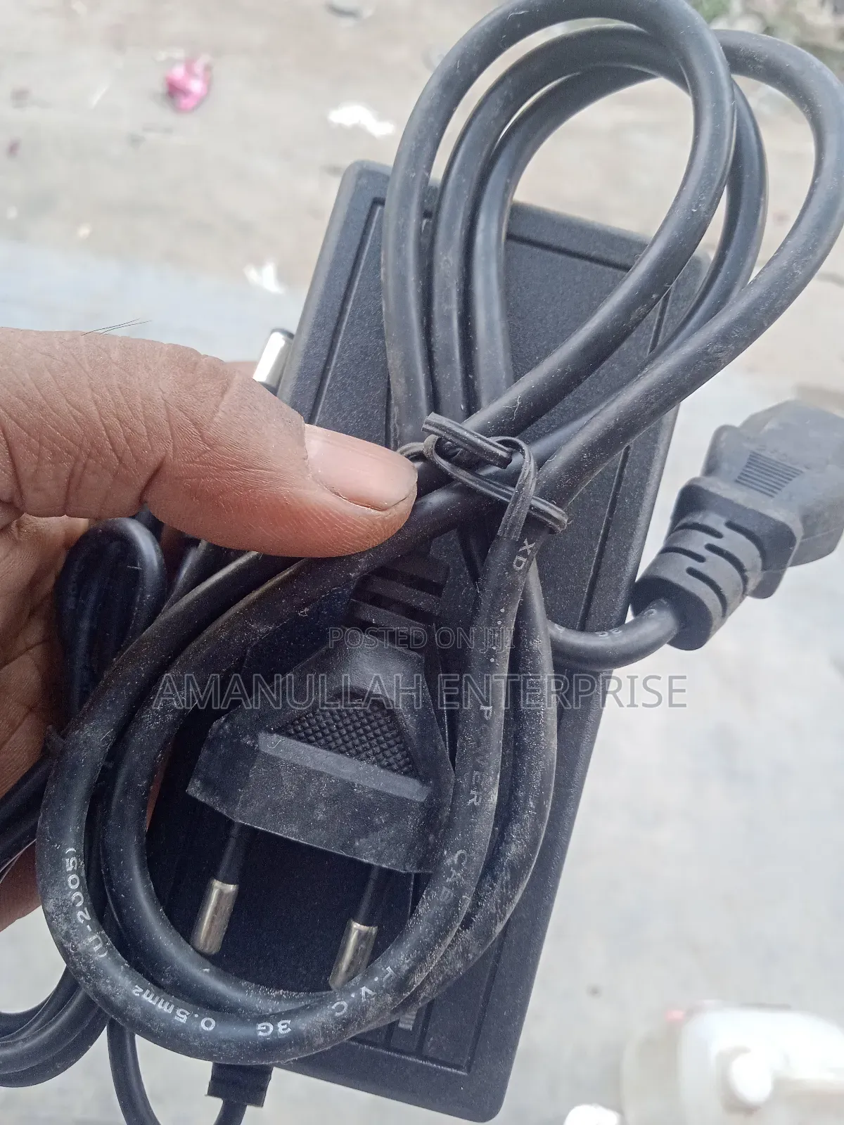 Ac - Dc Power Adapter Powering Various Electronic Devices.