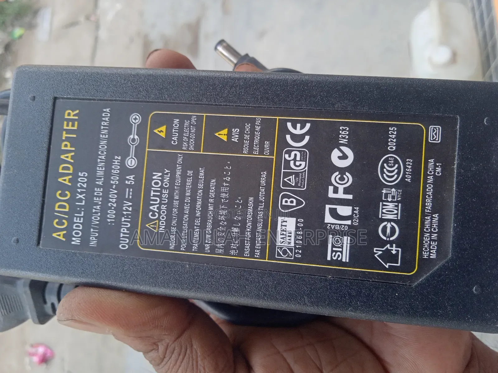 Ac - Dc Power Adapter Powering Various Electronic Devices.