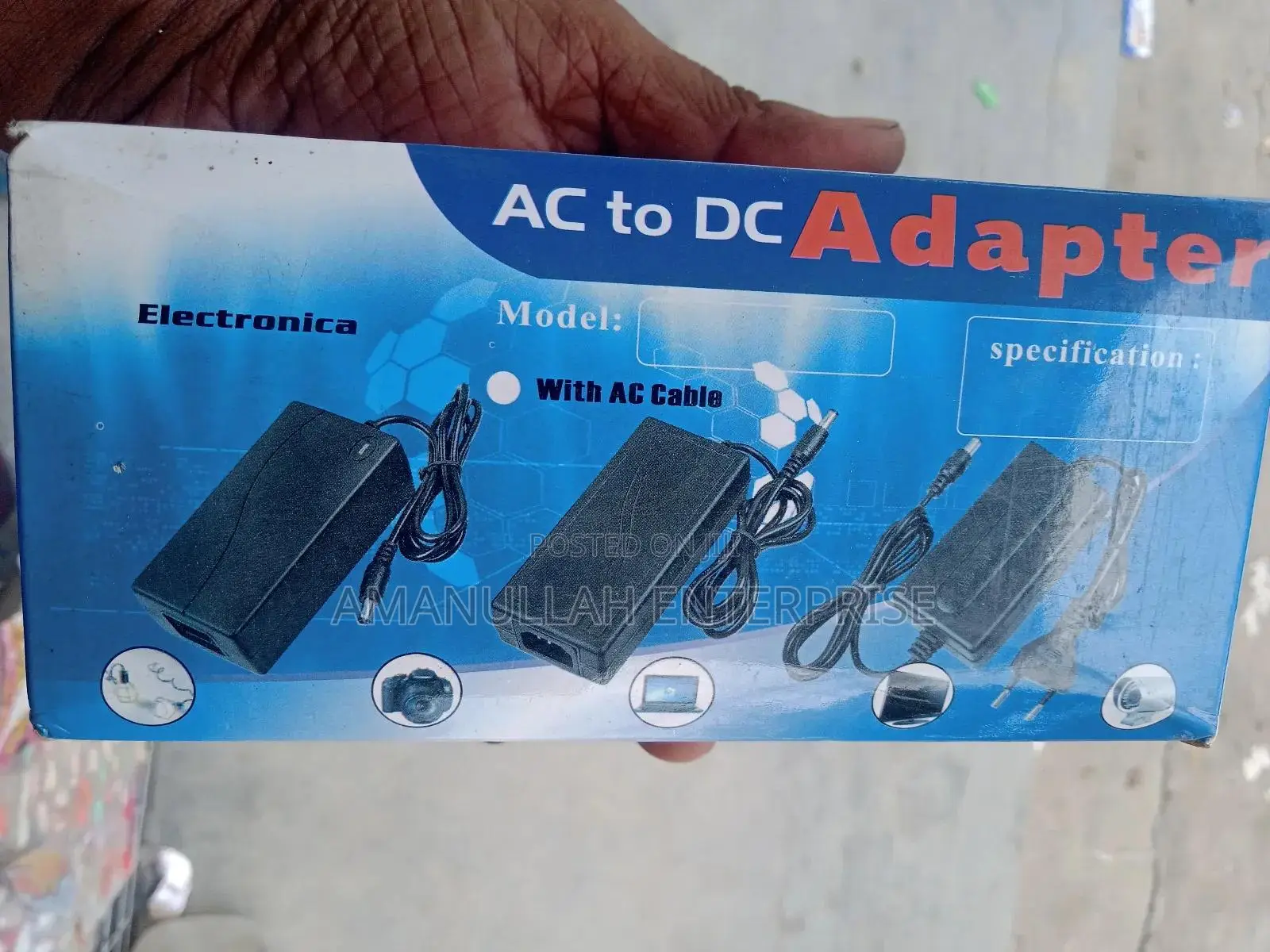 Ac - Dc Power Adapter Powering Various Electronic Devices.