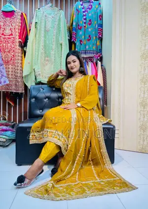 Student Doing Embroidery Work on Georgette Fabric.