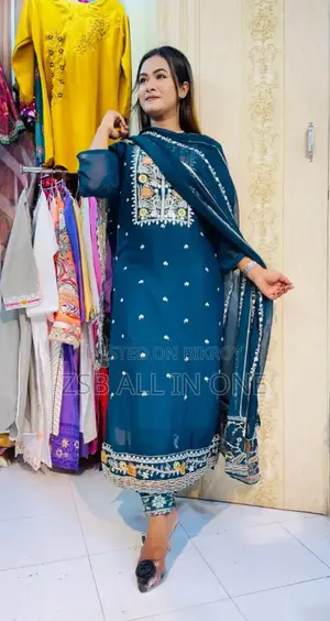 Student Doing Embroidery Work on Georgette Fabric.