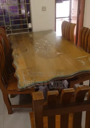 Photo - Dining Table With Six Chairs and Top Glass