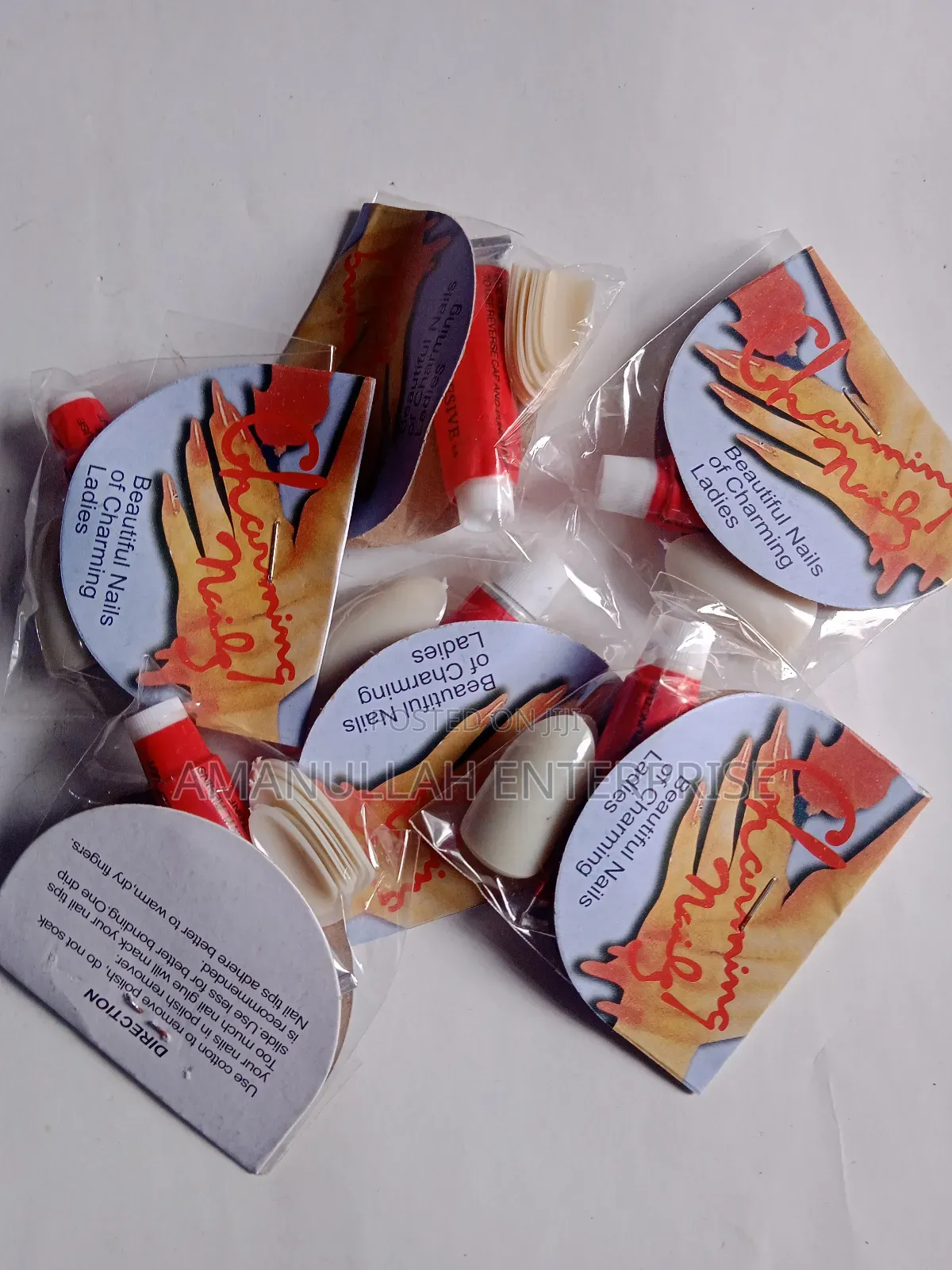 "Beautiful Nails of Charming Ladies" Which Includes Nail Adhesive.