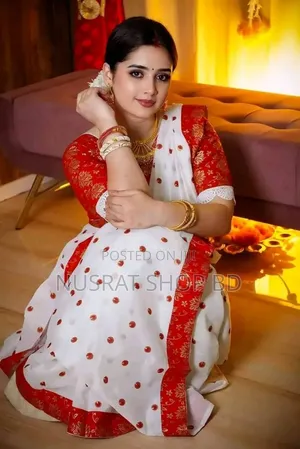 Photo - Half Silk Sharee With Blouse Piece
 আকর্ষণীয় লাল পেড়ে সাদা শাড়ী।