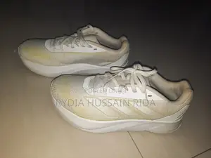 Photo - White Original Adidas Shoes