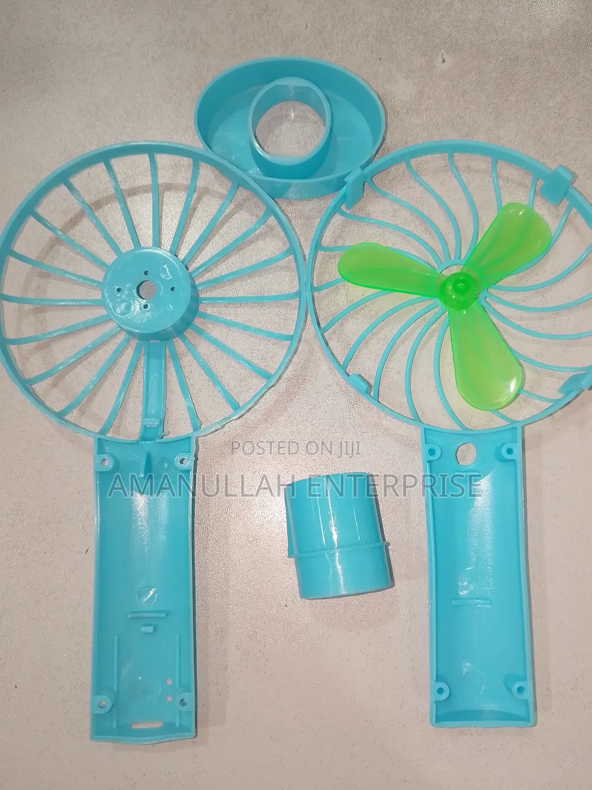 Disassembled Components of a Portable Rechargeable Mini Fan.