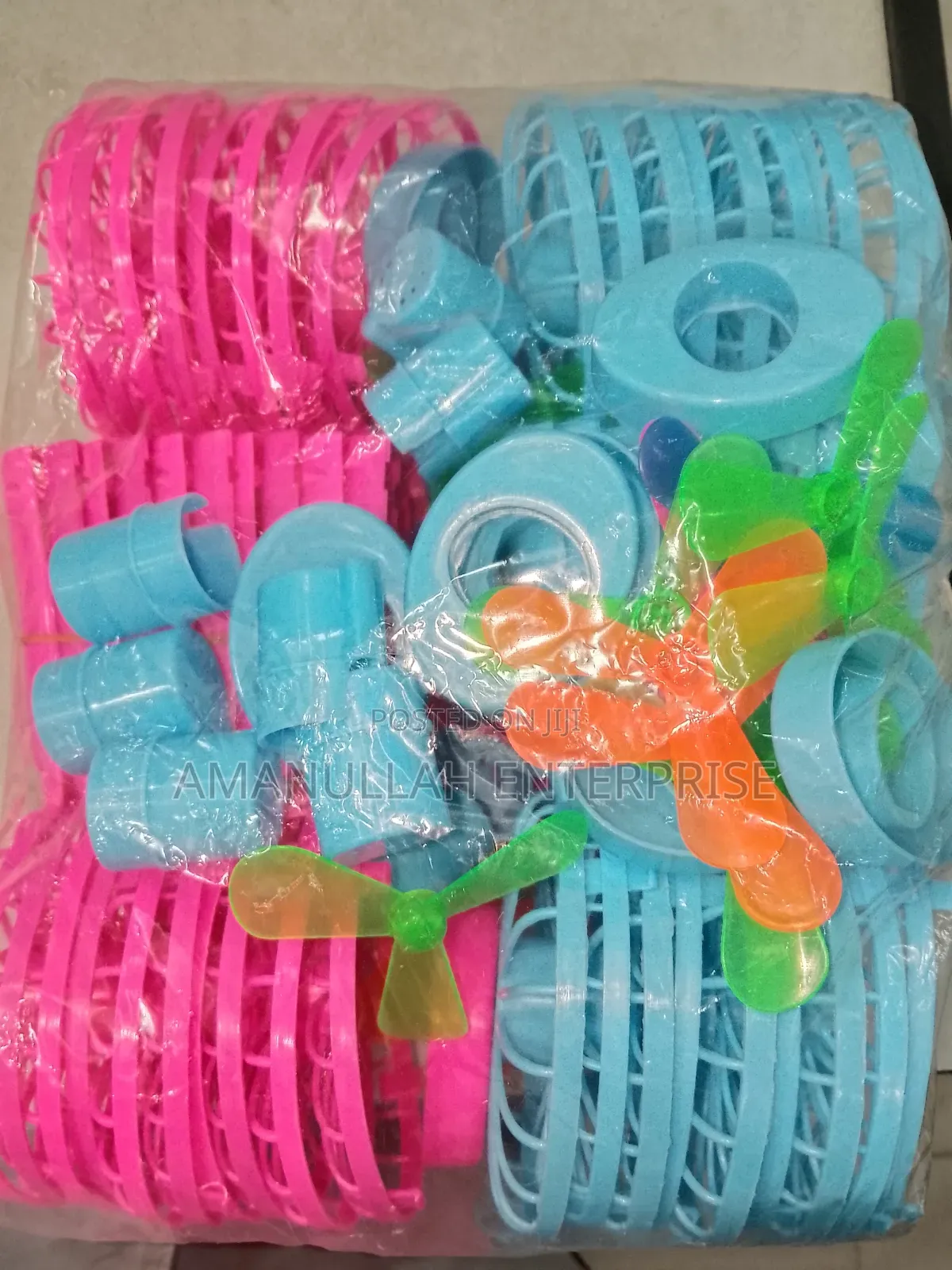 Disassembled Components of a Portable Rechargeable Mini Fan.