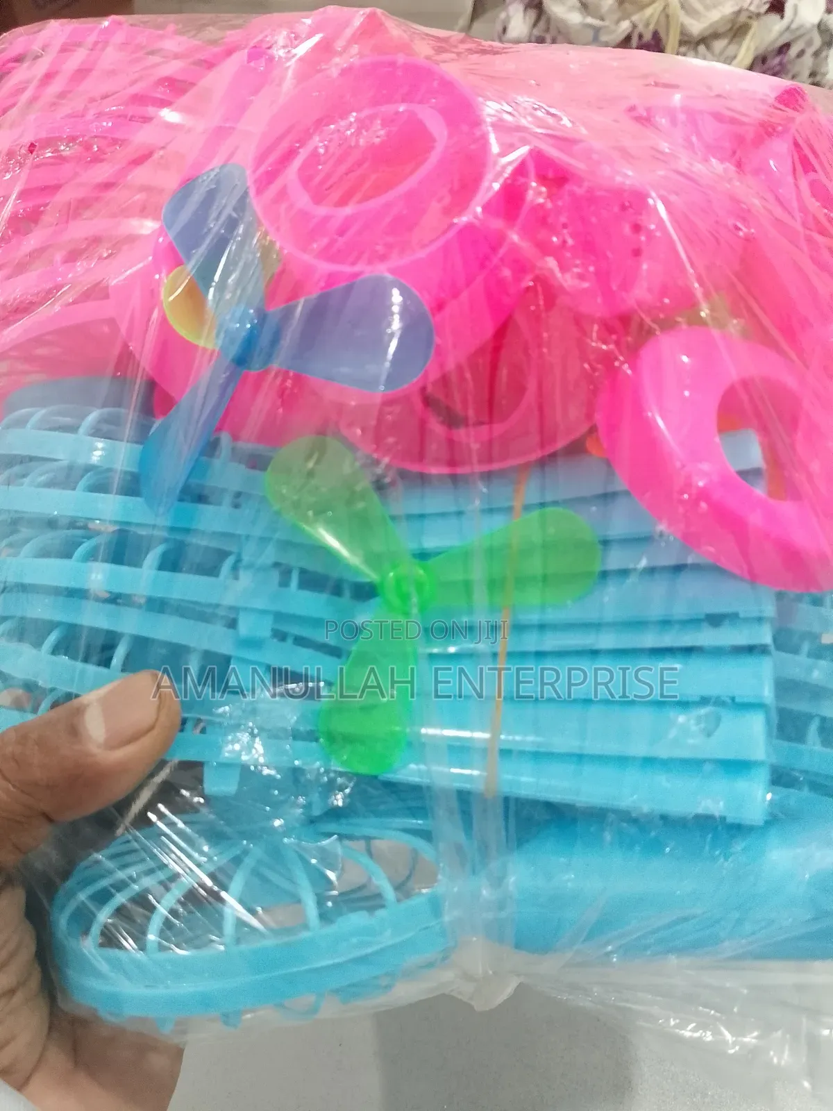 Disassembled Components of a Portable Rechargeable Mini Fan.