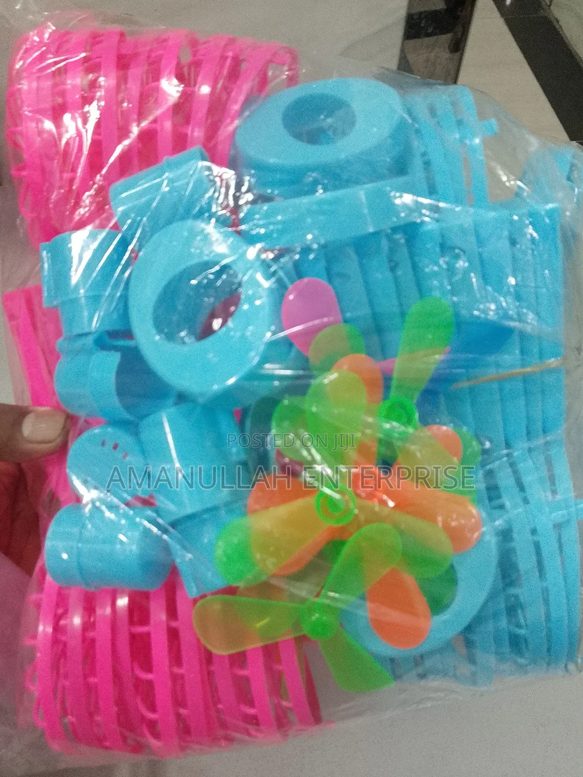 Disassembled Components of a Portable Rechargeable Mini Fan.