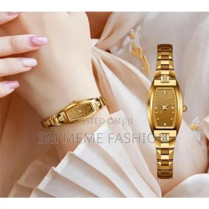 Photo - Case Shape: Tonneau Dial Window Material Type: Coated Glass