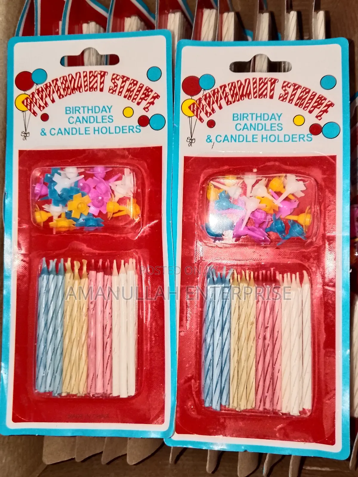 Multicolored Spiral Birthday Candles and Small, Flower-Shaped Candle.