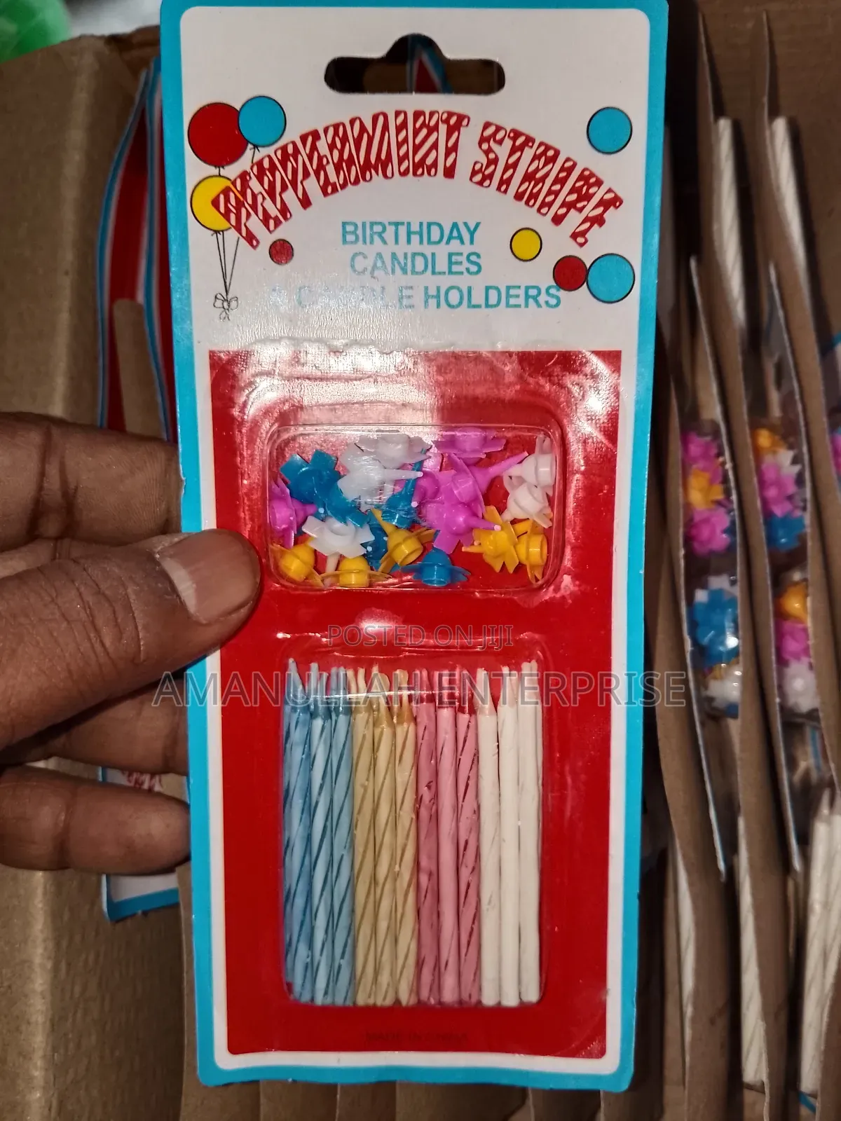 Multicolored Spiral Birthday Candles and Small, Flower-Shaped Candle.