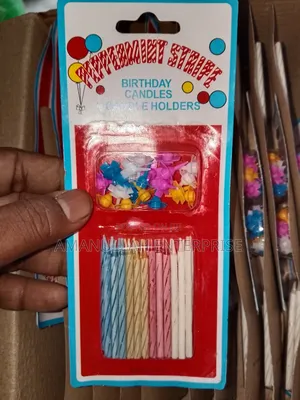 Multicolored Spiral Birthday Candles and Small, Flower-Shaped Candle.