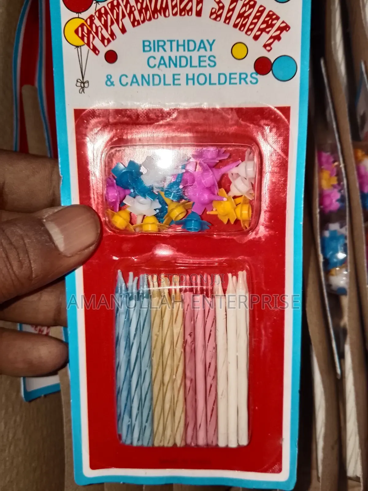 Multicolored Spiral Birthday Candles and Small, Flower-Shaped Candle.