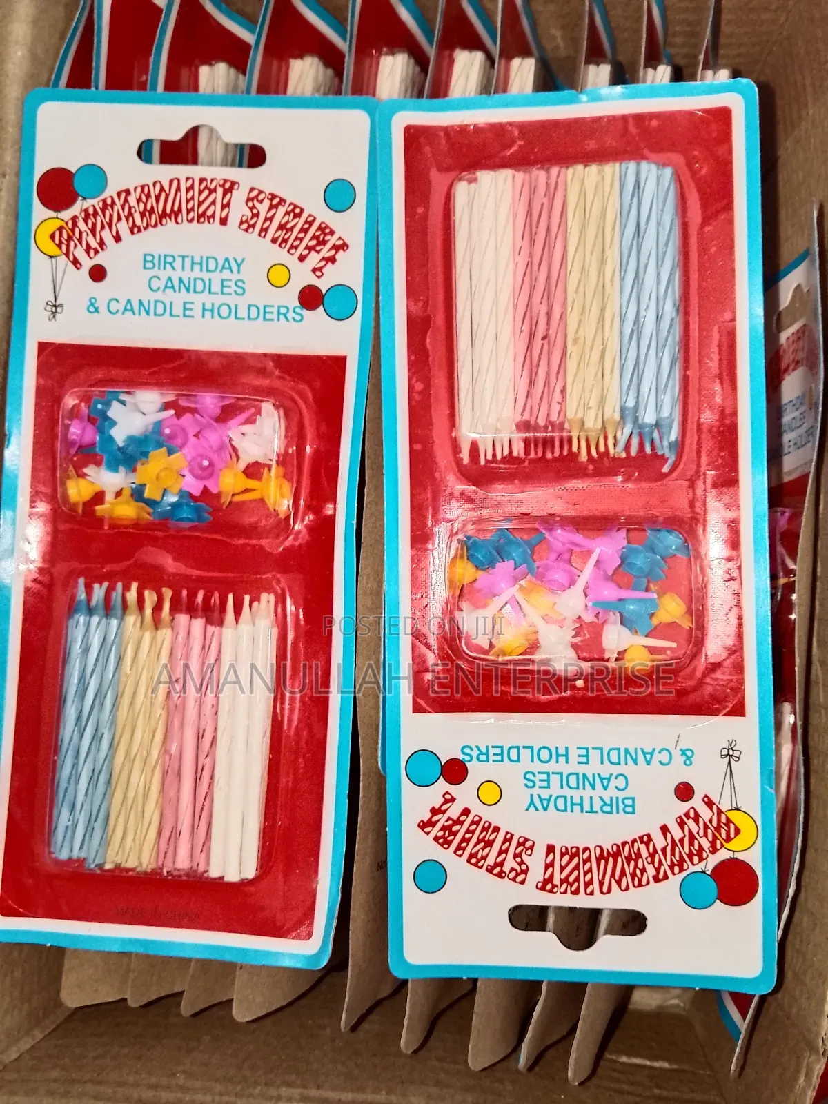 Multicolored Spiral Birthday Candles and Small, Flower-Shaped Candle.