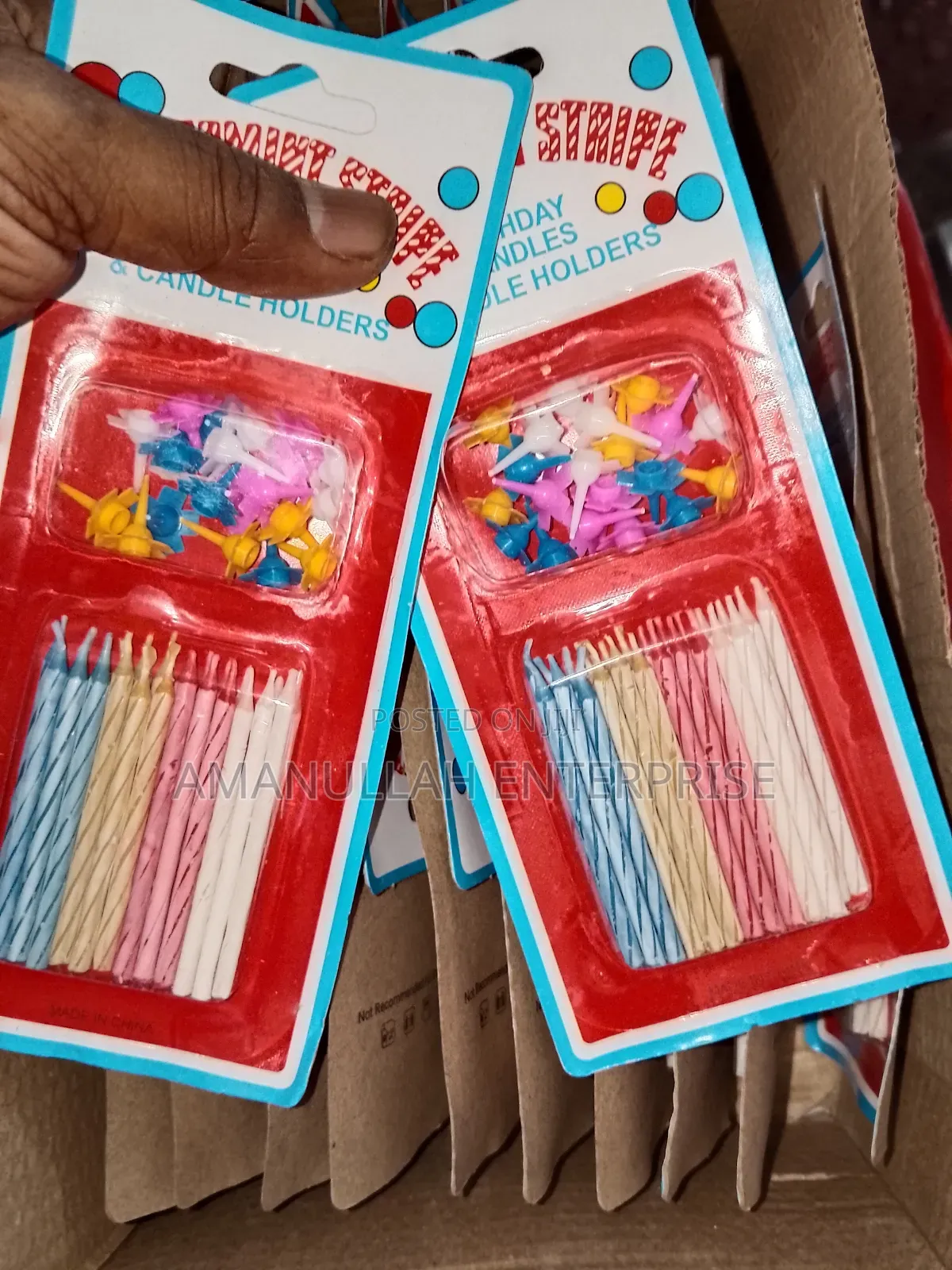 Multicolored Spiral Birthday Candles and Small, Flower-Shaped Candle.