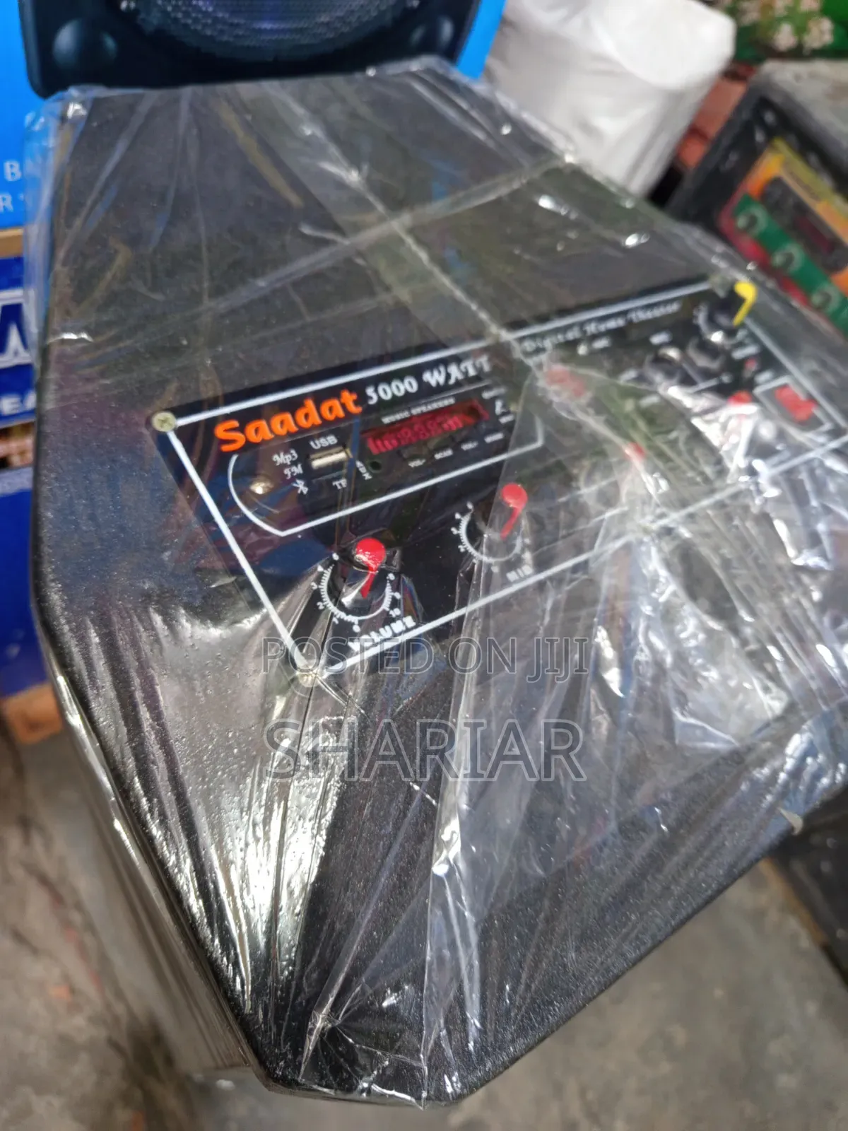 Model: B12d, 12" Chinese Speaker Box Attached to an Amplifier.