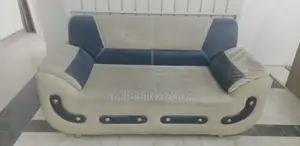 Used six-seater sofa and cover for sale.