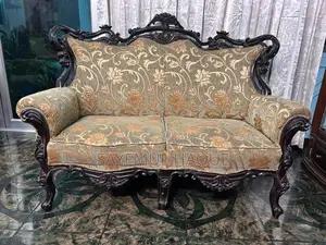 Teak wood sofa, divan set, and table.