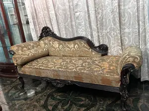 Teak wood sofa, divan set, and table.