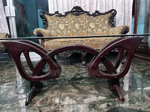 Teak wood sofa, divan set, and table.