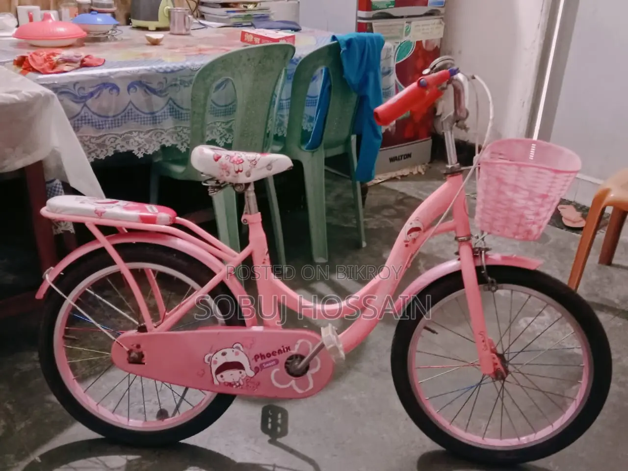A small ladies' bicycle is for sale.