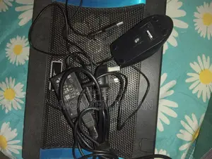 একটি চার্জার, মাউস ও ল্যাপটপ কুলার
