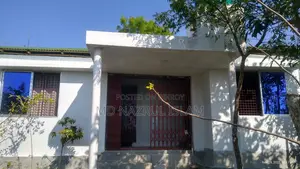 Land with house for sale.