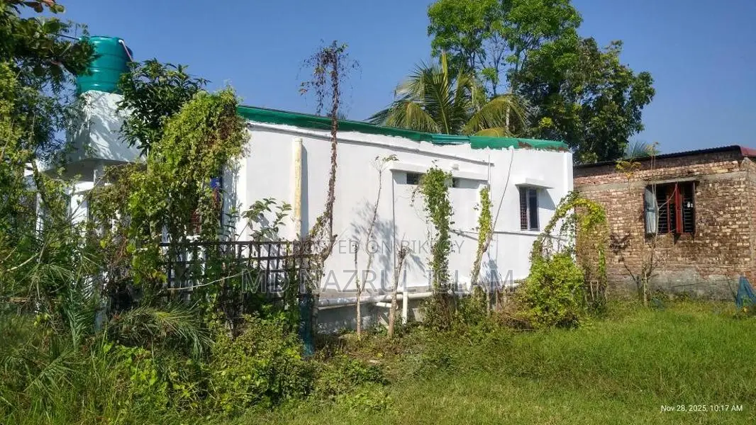 Land with house for sale.