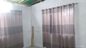 Land with house for sale.
