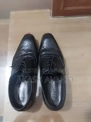 A pair of almost new original leather shoes for sale